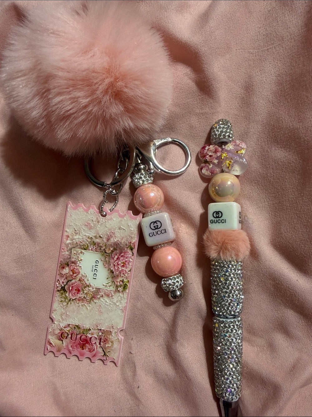 Pink matching keychain and rhinestone pen with extra pen refill.